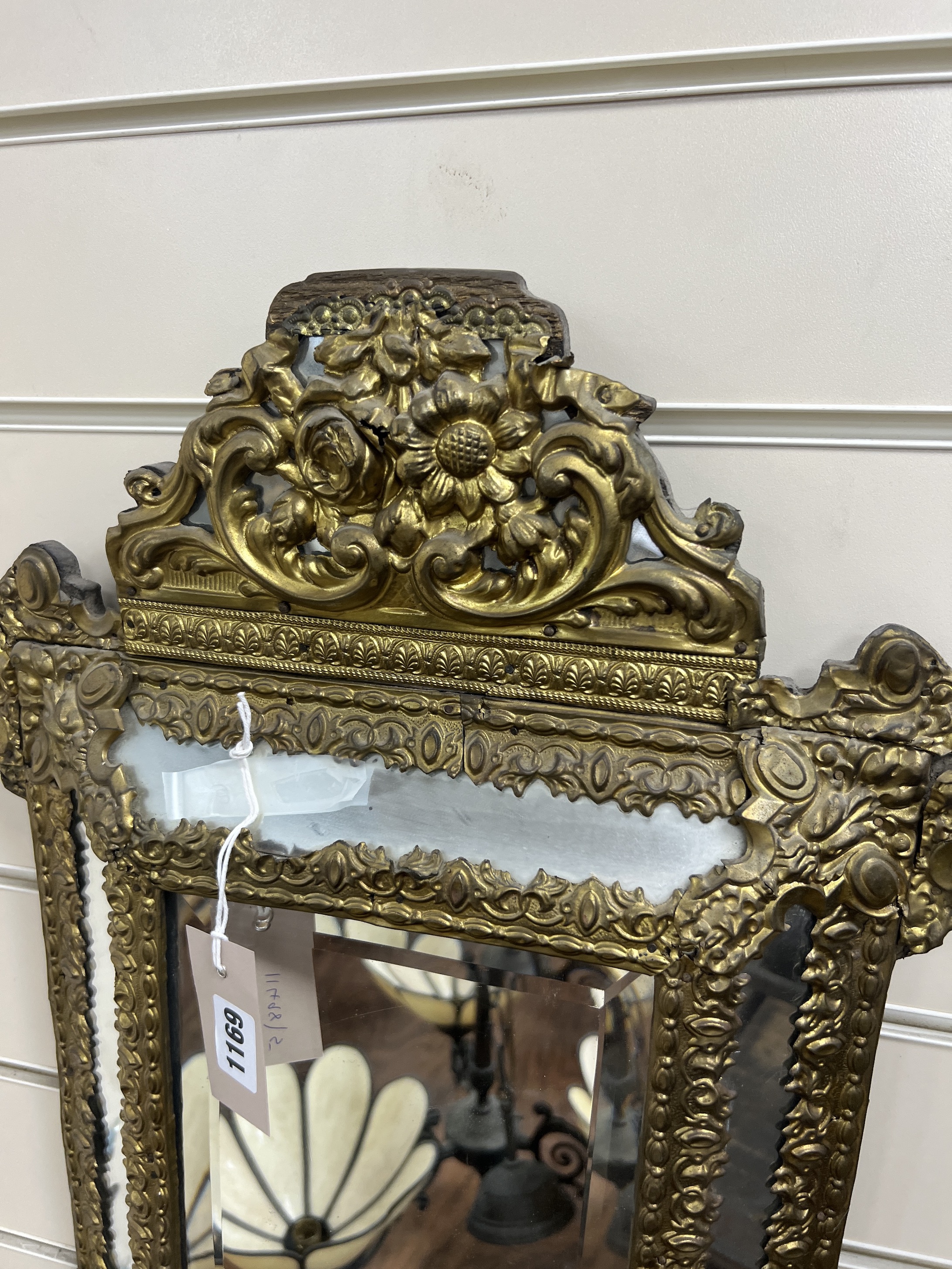 A 19th century French embossed brass wall mirror, width 39cm, height 54cm